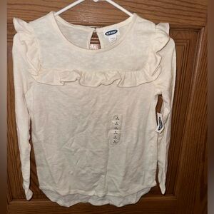 Long sleeve, ruffle Girls shirt cream colored